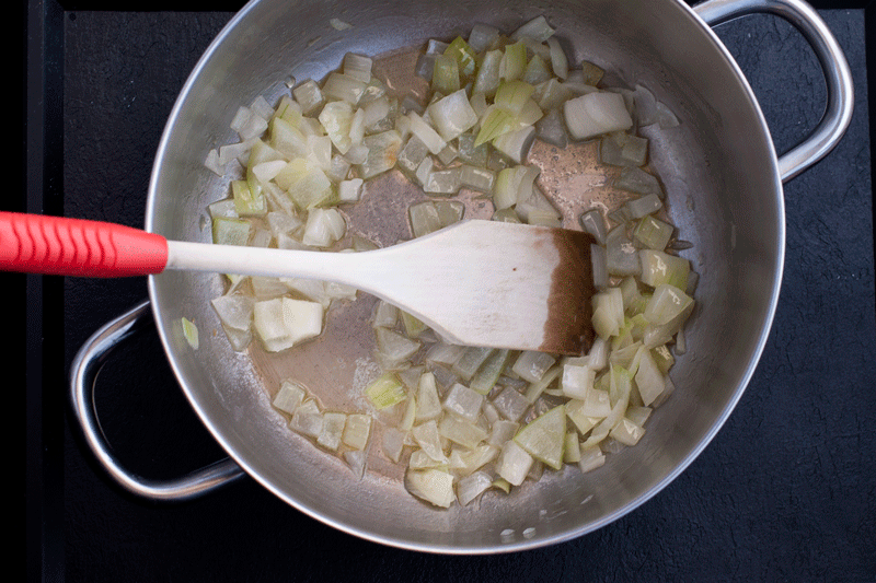 Add the first ladle of warm stock