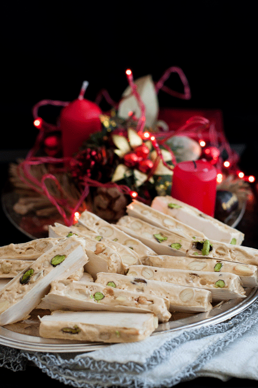 Torrone Italian Nougat Recipe with Christmas decoration on the background