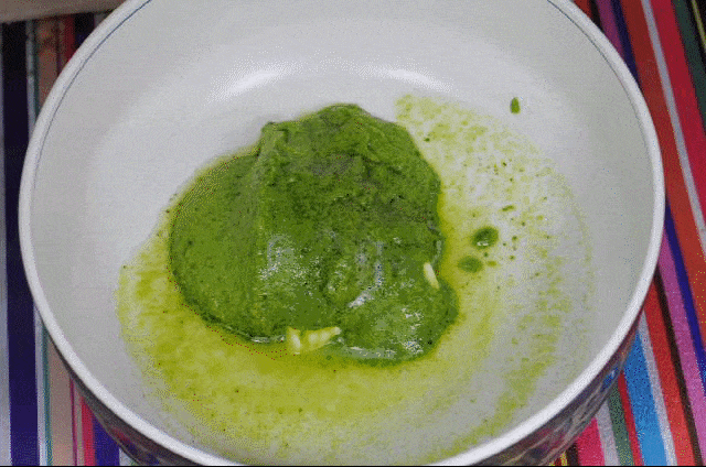 Add butter and pasta water to the pesto