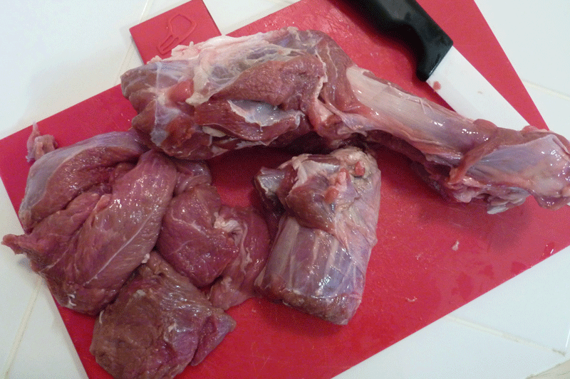 Leg of lamb cut in pieces and lamb bone