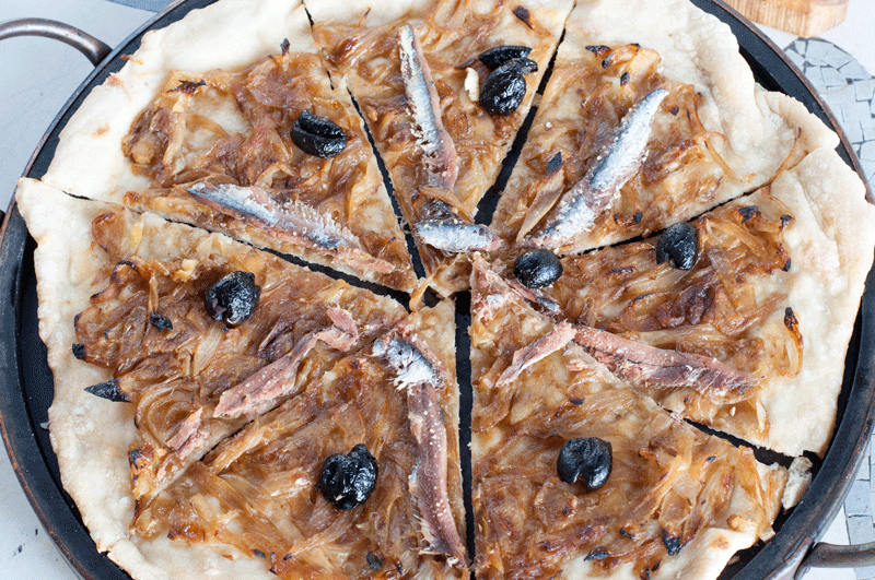 Serve pissaladiere warm or at room temperature