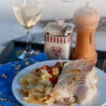 This healthy cod recipe is a classic here in Italy, the cod cooks in the oven for 20 minutes over a thin layer of potatoes and onions. #yourguardianchef #seafood #healthyfood