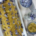 Swiss roll sponge recipe with buttercream decorated with homemade crystallized violets and pistachios. The perfect cake for a spring celebration #yourguardianchef #dessert #recipe