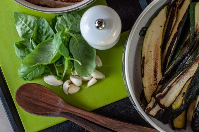 basil garlic salt and olive oil on a cutting board
