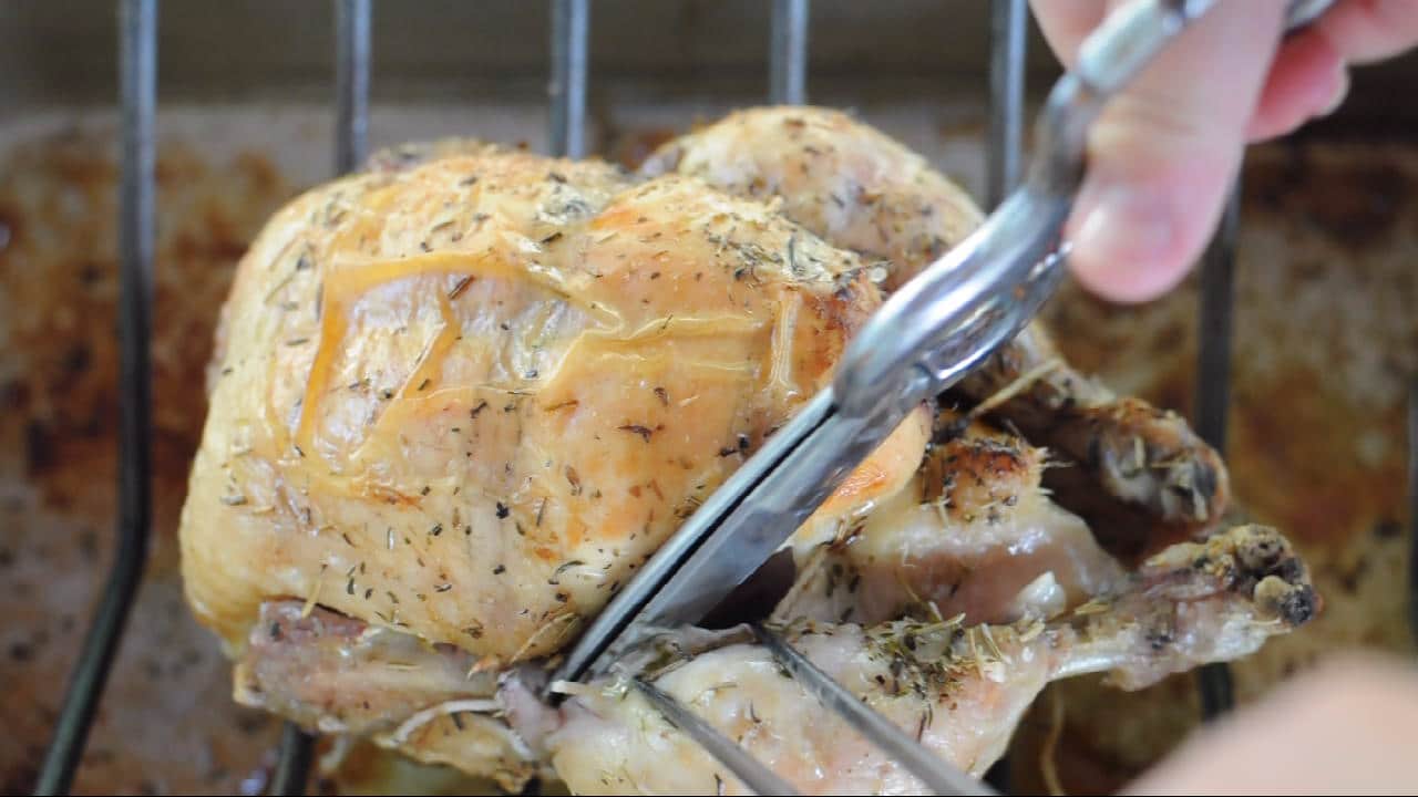 roasted chicken cutting the leg