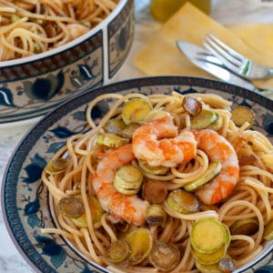 Pasta zucchini with shrimp served on a plate