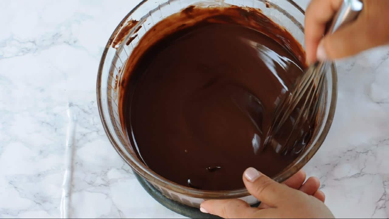 stirring the melted chocolate