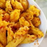 A typical Mediterranean dish: Fried Zucchini Flowers or Squash blossom in English, and in France they are called Beignets de Fleurs de Courgette. You can find different recipes for the batter as well as the filling, I use a simple batter flavoured with saffron and fill them with mozzarella and ham.