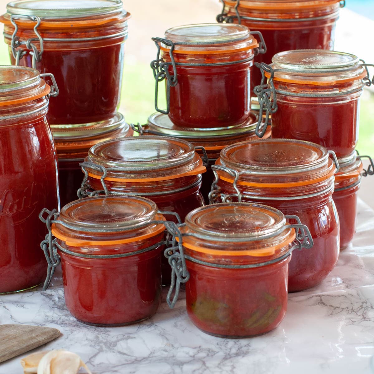 Tomato sauce with fresh tomatoes in jars