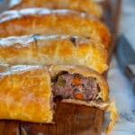 This beef sausage hand pie recipe is a complete meal perfect for picnics as you can eat it at room temperature with your hands and without any mess. The filling is made with half beef and half pork mixed with diced carrot, celery, and onion and flavoured with a touch of Cognac.