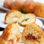 Arancini are a tradition in the South of Italy. They are risotto balls filled with cheese and/or meat, coated with breadcrumbs and fried. I make regular ones filled with Bolognese, vegetarian and gluten-free, replacing the breadcrumbs and doing some testing.