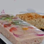 Ham spread terrine is elegant, delicate, and creamy. Decorated with herbs and flavored with cognac, it is very easy to make and you can make it days before your party. Turning leftover ham in a fancy dish.
