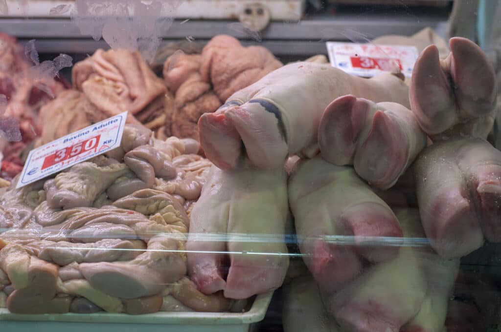 Pig feet and cow stomach in a butcher display