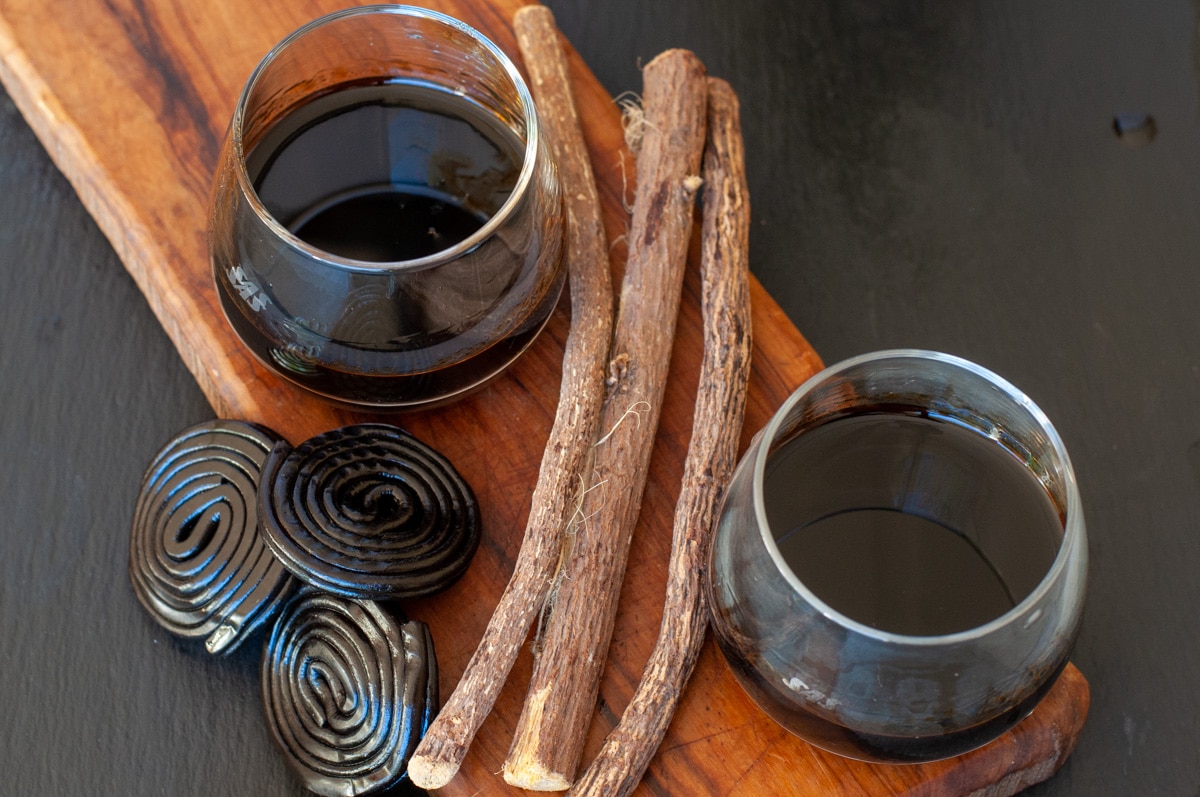 licorice roots with licorice candies and liqueur