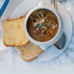 An Italian chicken soup made from scratch as a minestrone can warm up any cold winter evening. Made with plenty of fresh vegetables, Borlotti beans, and homemade chicken stock, you can eat it as it is with some toasted bread or adding some pastina.
