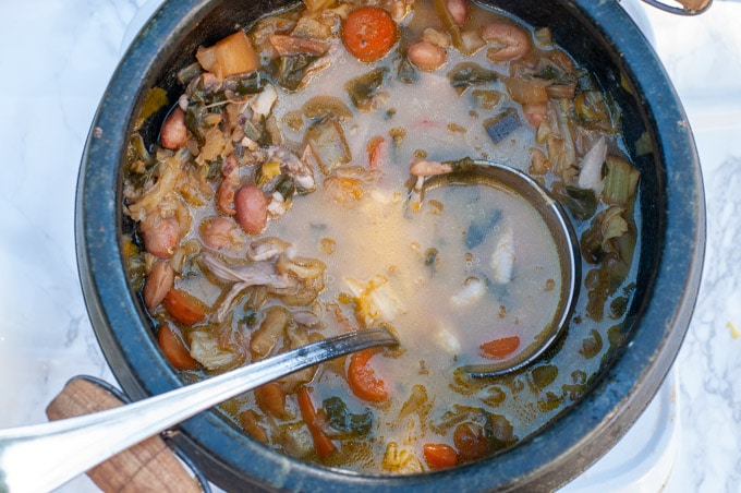 italian chicken soup minestrone in a stone pot