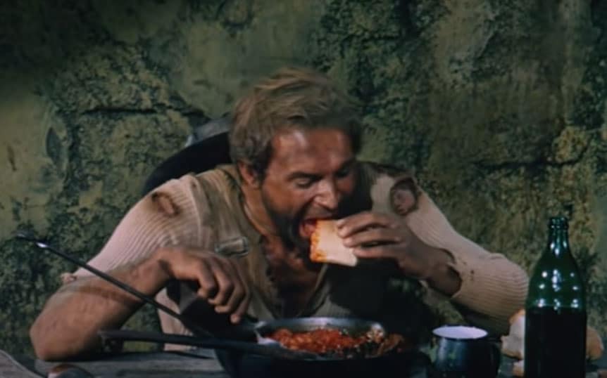 Terence Hill eating baked beans in a Spaghetti western movie