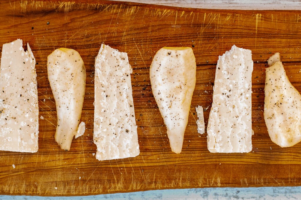 pears and Parmesan cheese on a cutting board