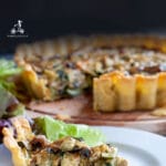 This zucchini mushroom quiche is perfect for a lunch with friends. You can prepare all the ingredients the day before and bake it just a few minutes before your friends arrive. It is full of healthy vegetables, enriched by eggs, stringy Emmental cheese, and crunchy bacon.