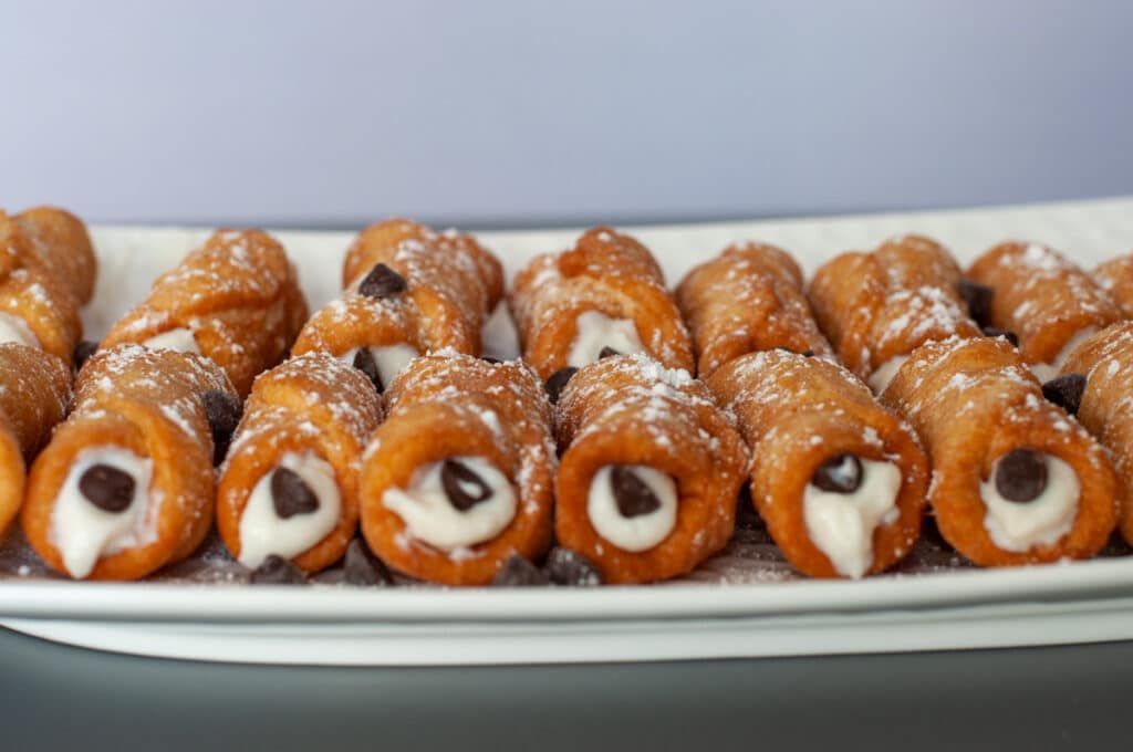 mini cannoli filled with ricotta cream and chocolate chips