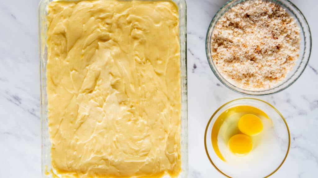 custard next to breadcrumbs and eggs