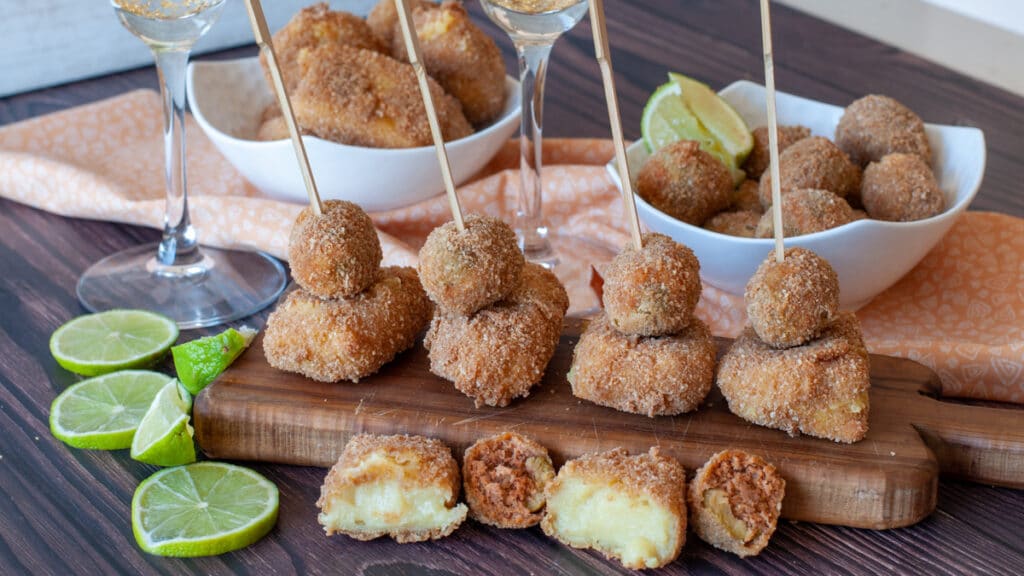 Fried stuffed olives olive ascolane and fried custard cremoni on a cutting board