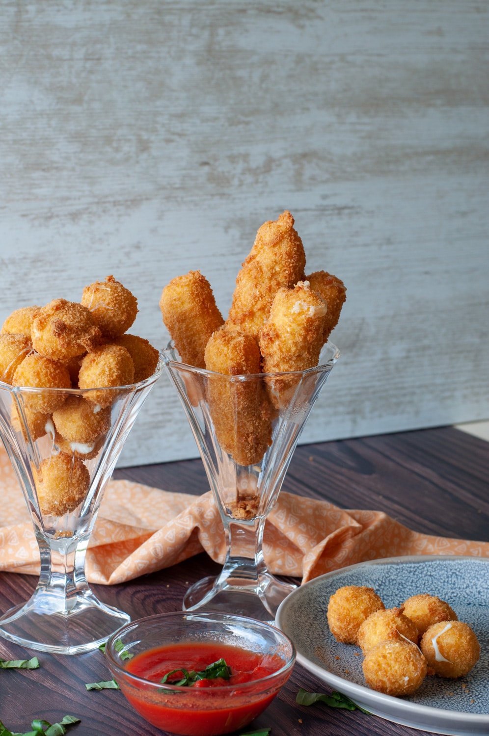 fried mozzarella served in tall glasses