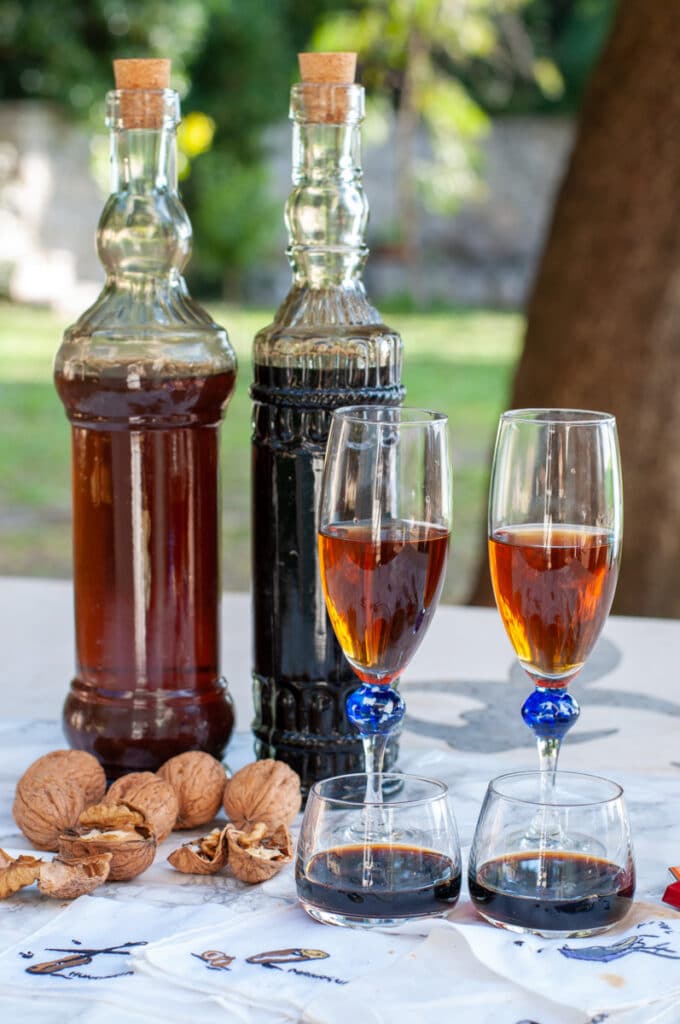 walnut liqueur Nocino in the bottles and glass