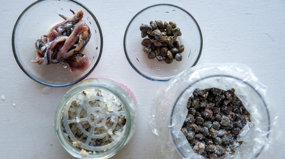 capers and anchovies stored in salt