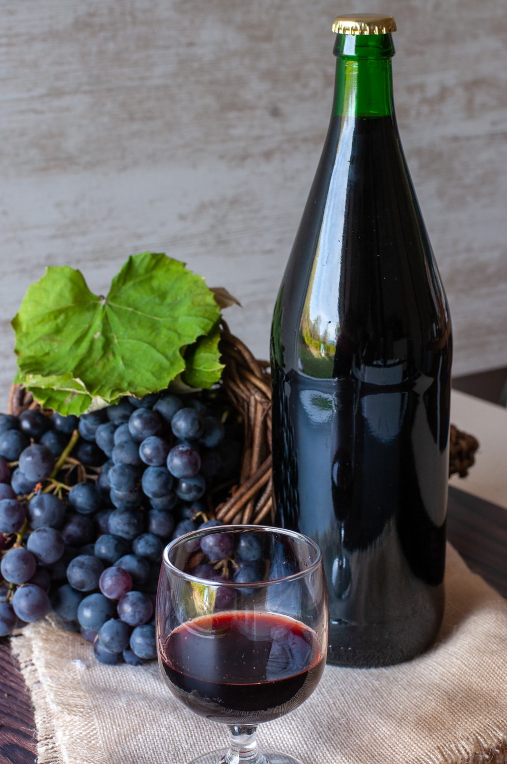 Concord Grape Wine Fragolino in a glass and bottle