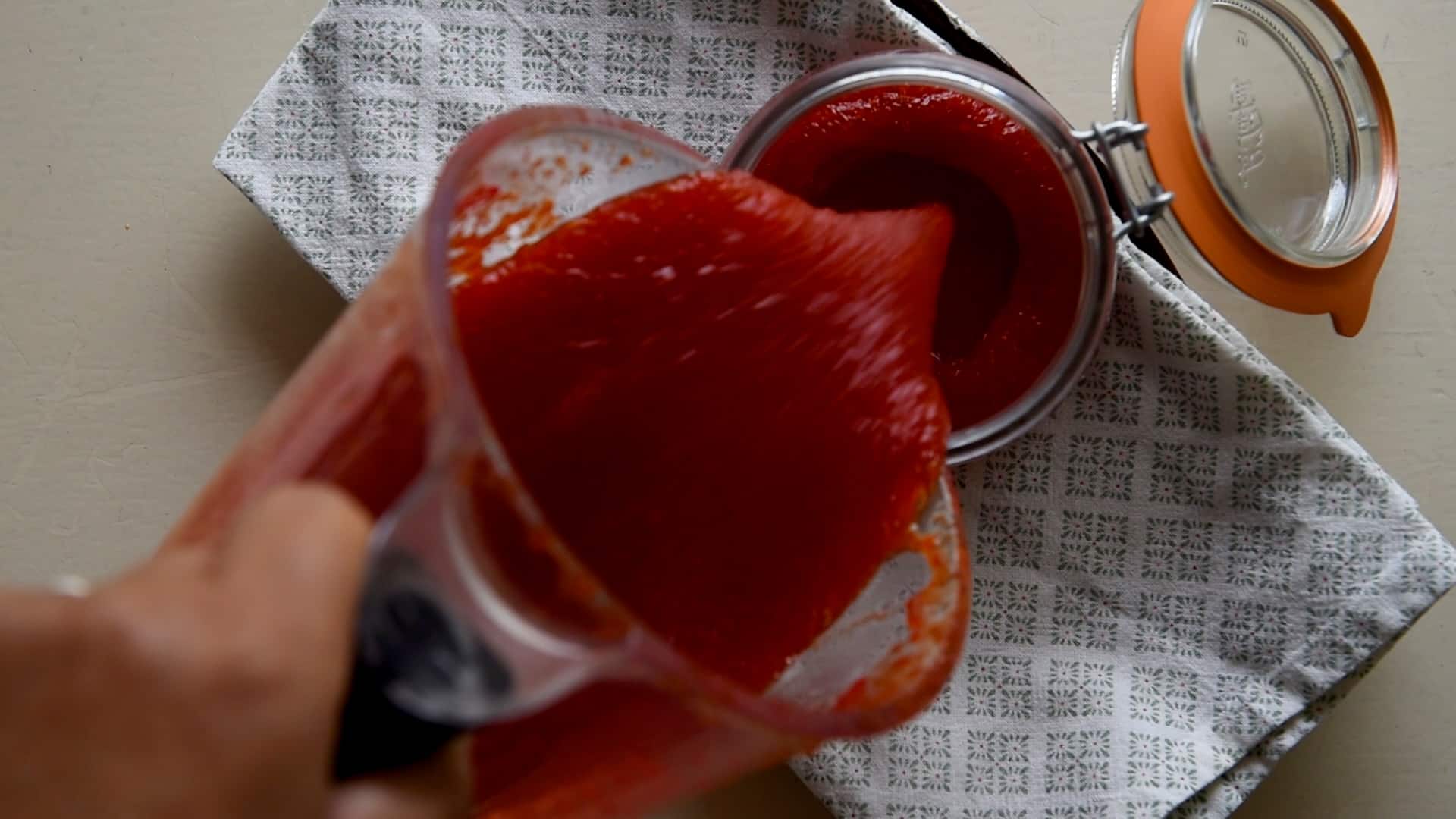 Pouring the jelly into a jar