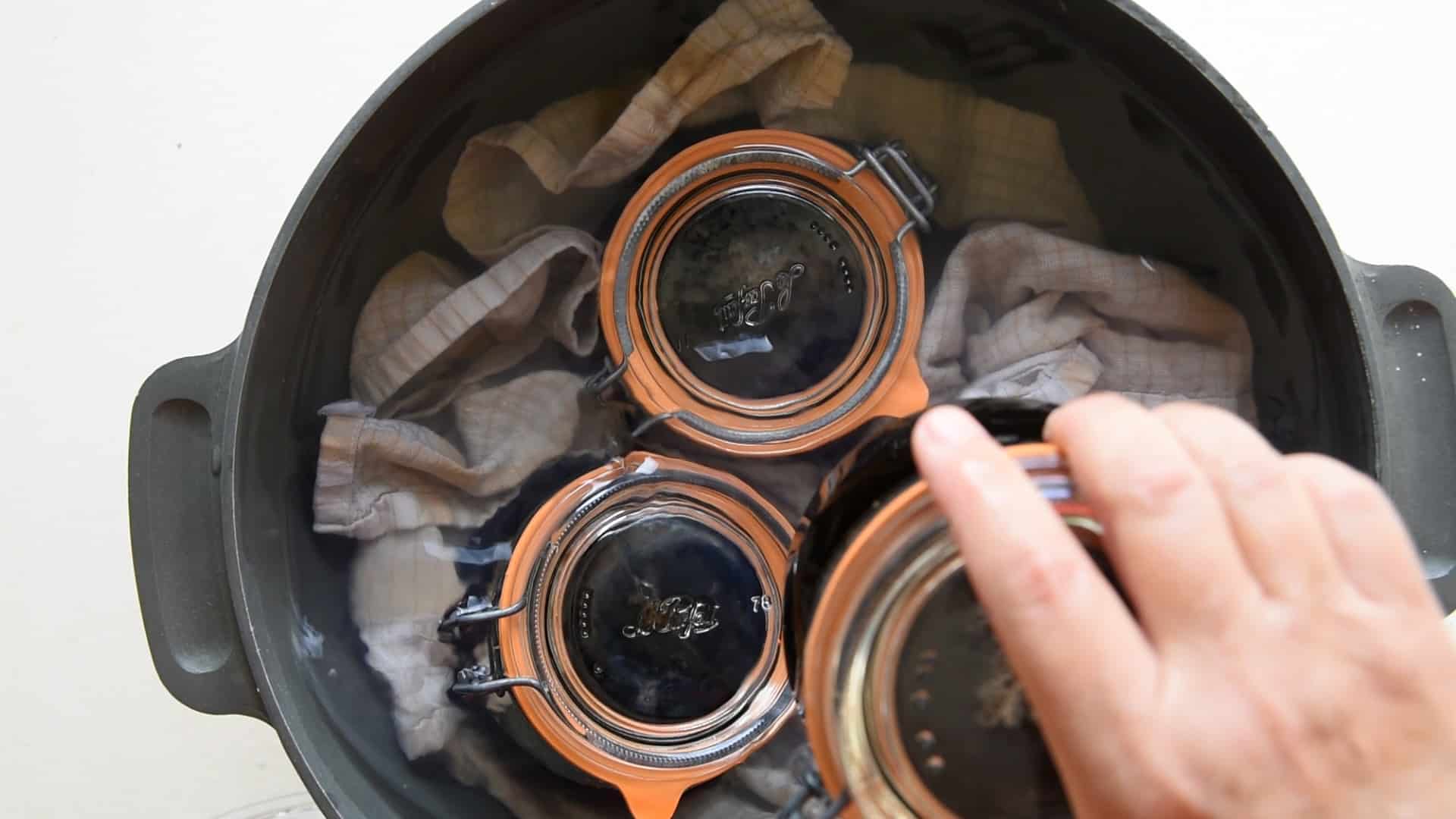 removing the jars from the pan