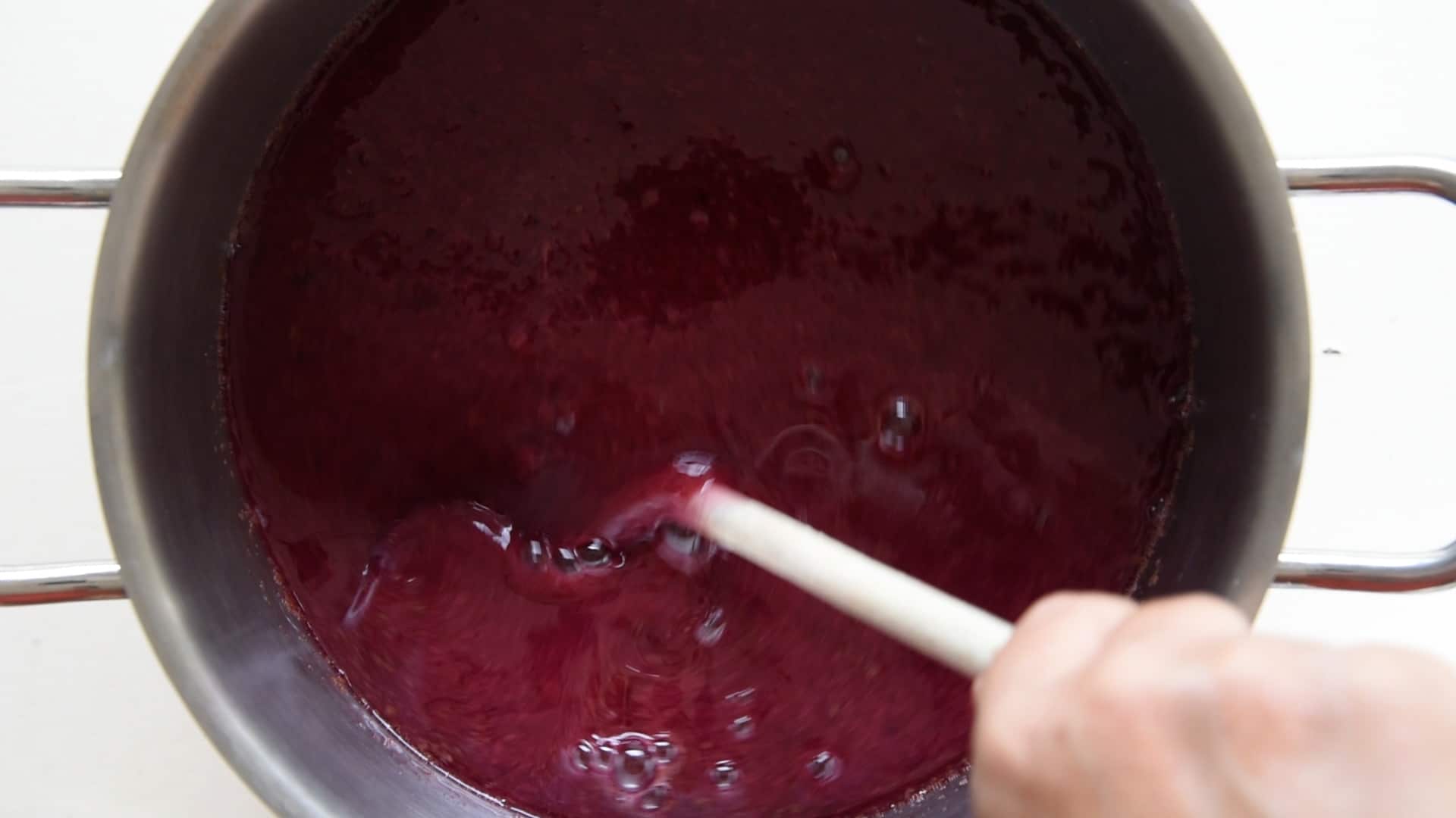 stirring sugar and grape juices