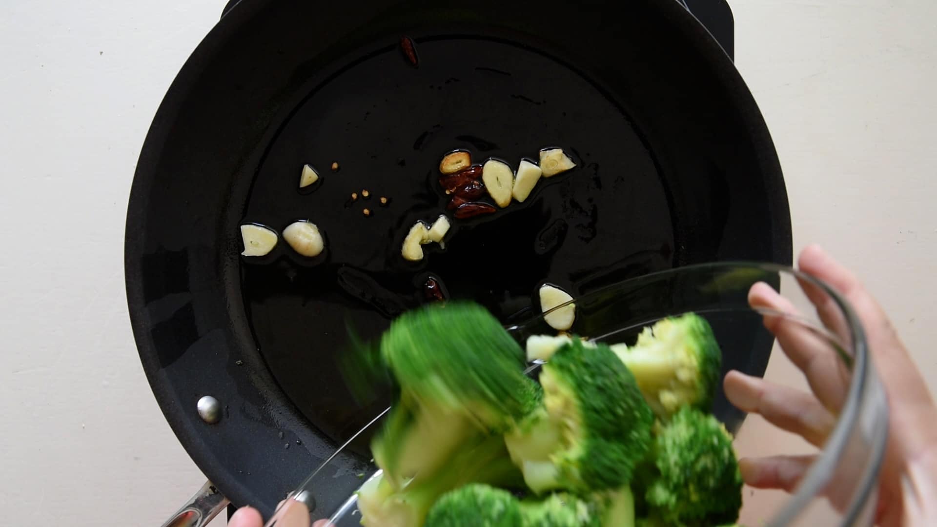 Add the broccoli to the frying pan