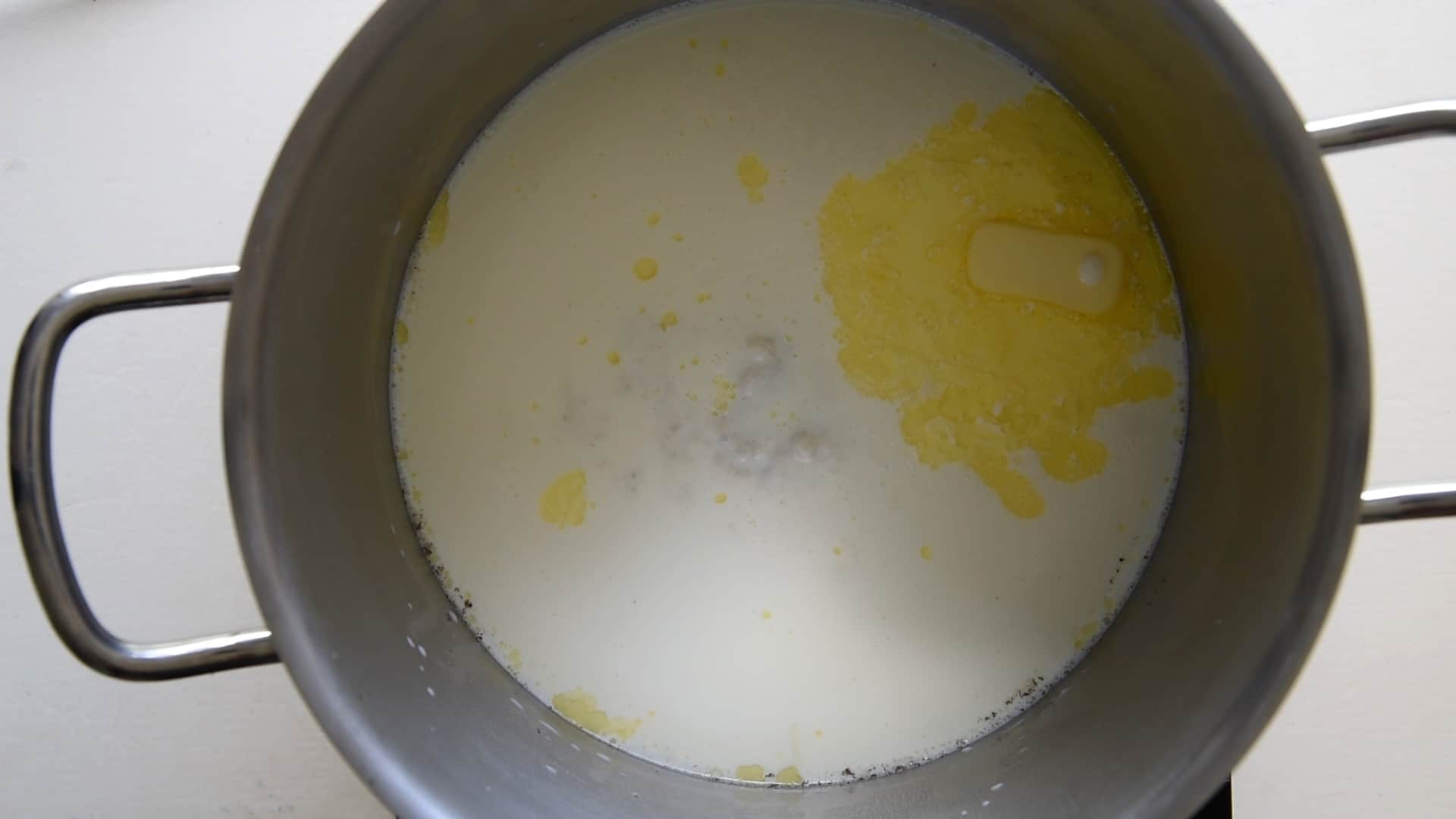 boiling the milk with butter in a pan