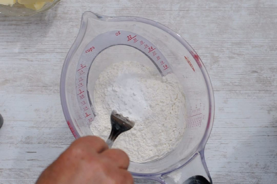 Sifting flour with the baking powder