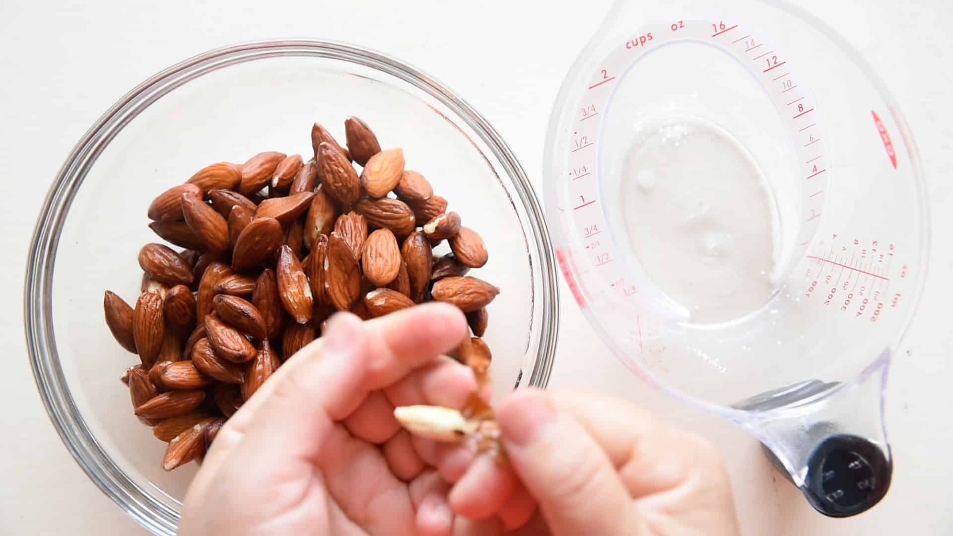 peel the almonds by squeezing the skin off