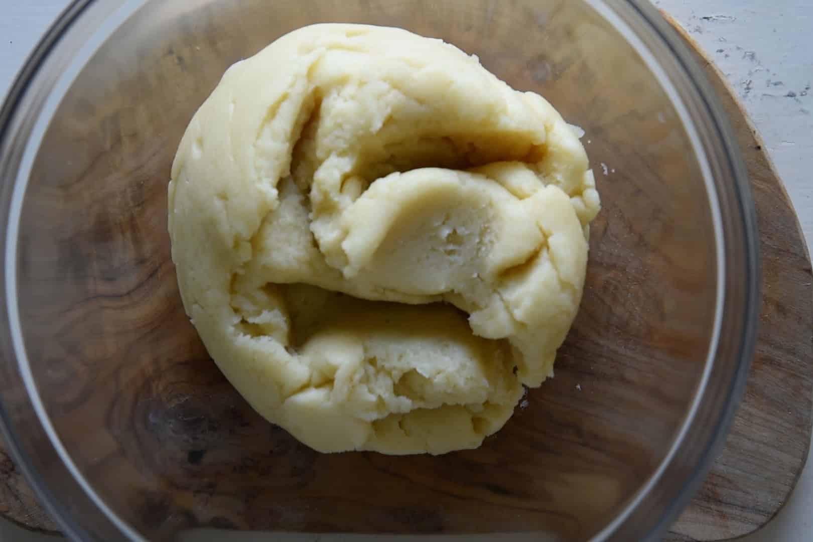 the choux dough on a glass bowl to cool down