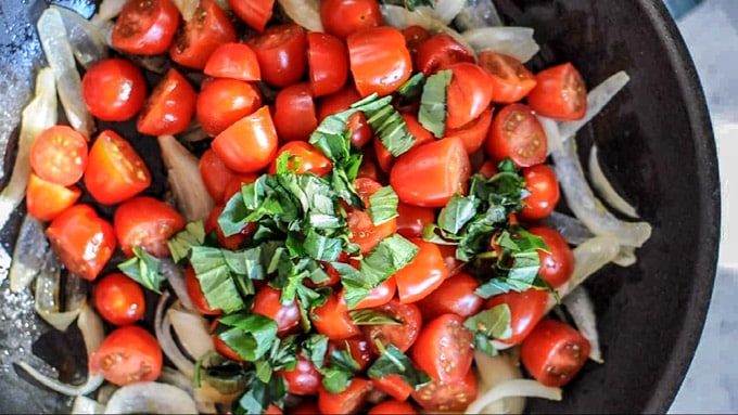 stir fry the cherry tomatoes and add basil