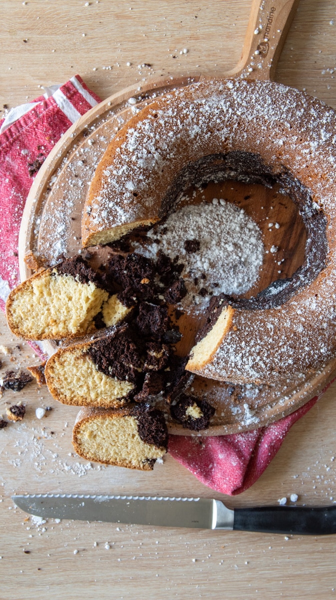 marble bundt cake on a cutting board vertical image