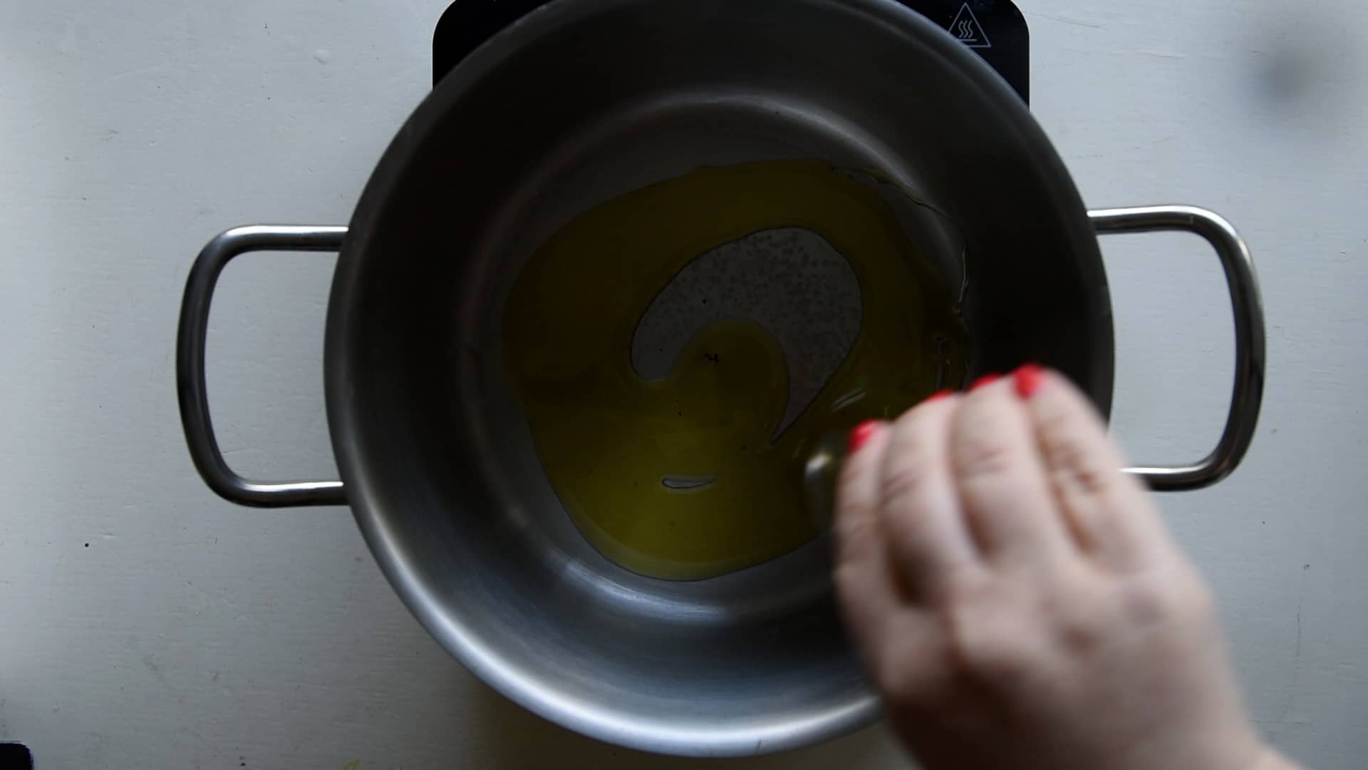 Pour some olive oil into a large pasta pot