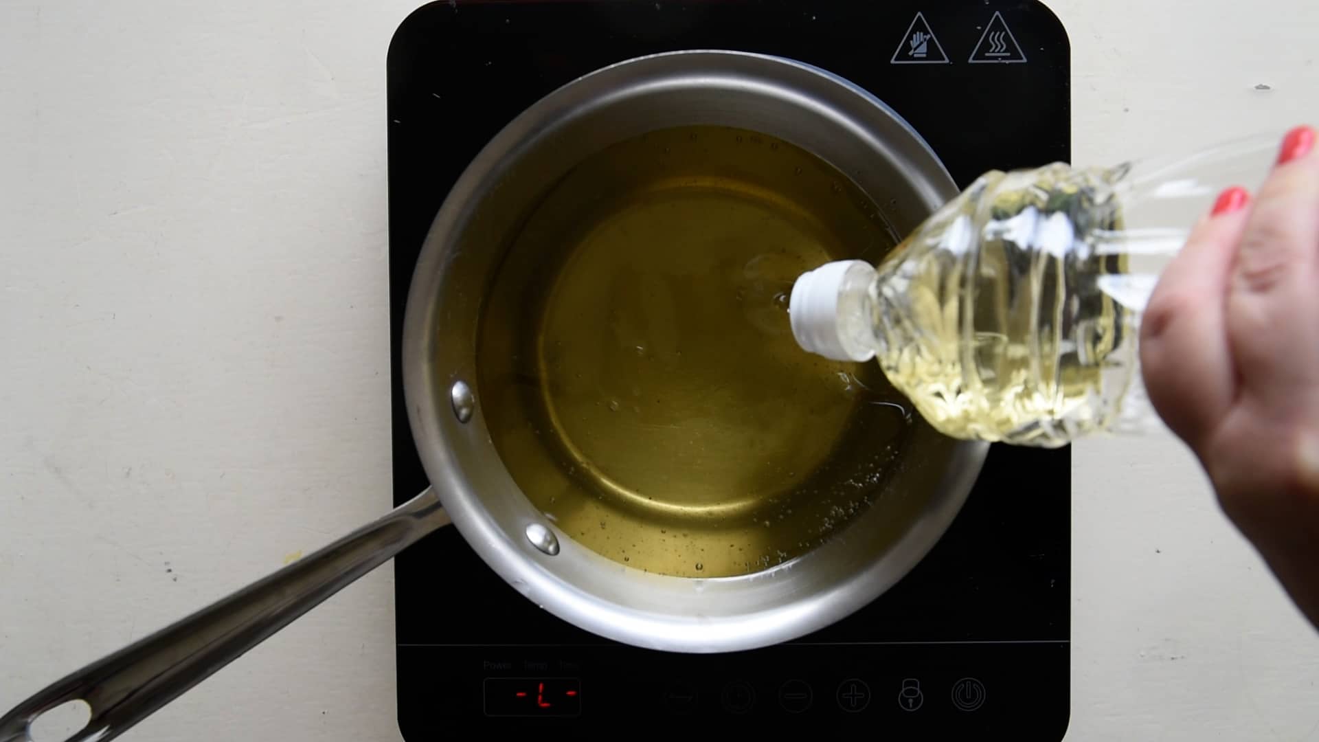 Place the frying oil in a pan
