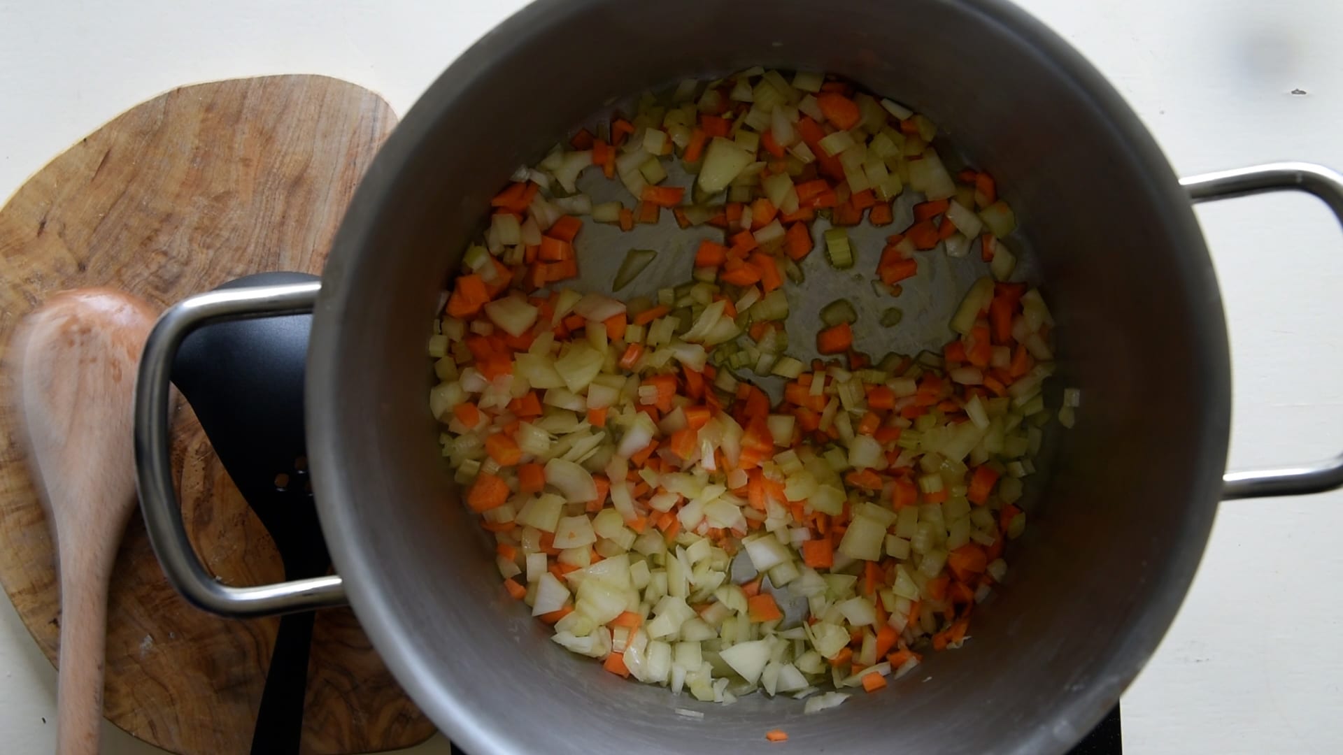Add diced carrot, celery and onion and stir fry to make a soffritto