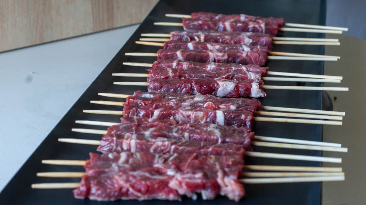 mutton arrosticini on a table top grill