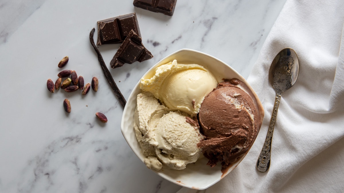 vanilla, pistachio, chocolate gelato served in a bowl