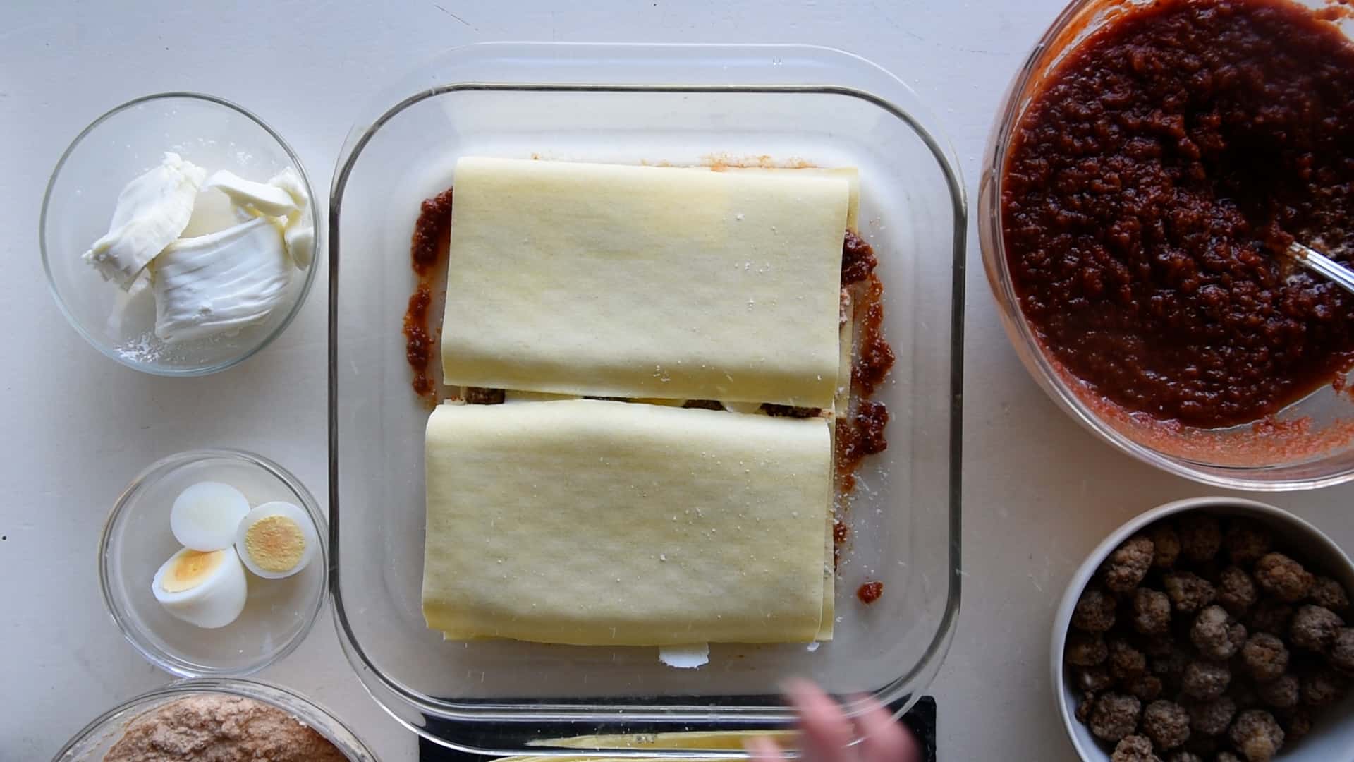 Cover with the next layer of lasagna sheets