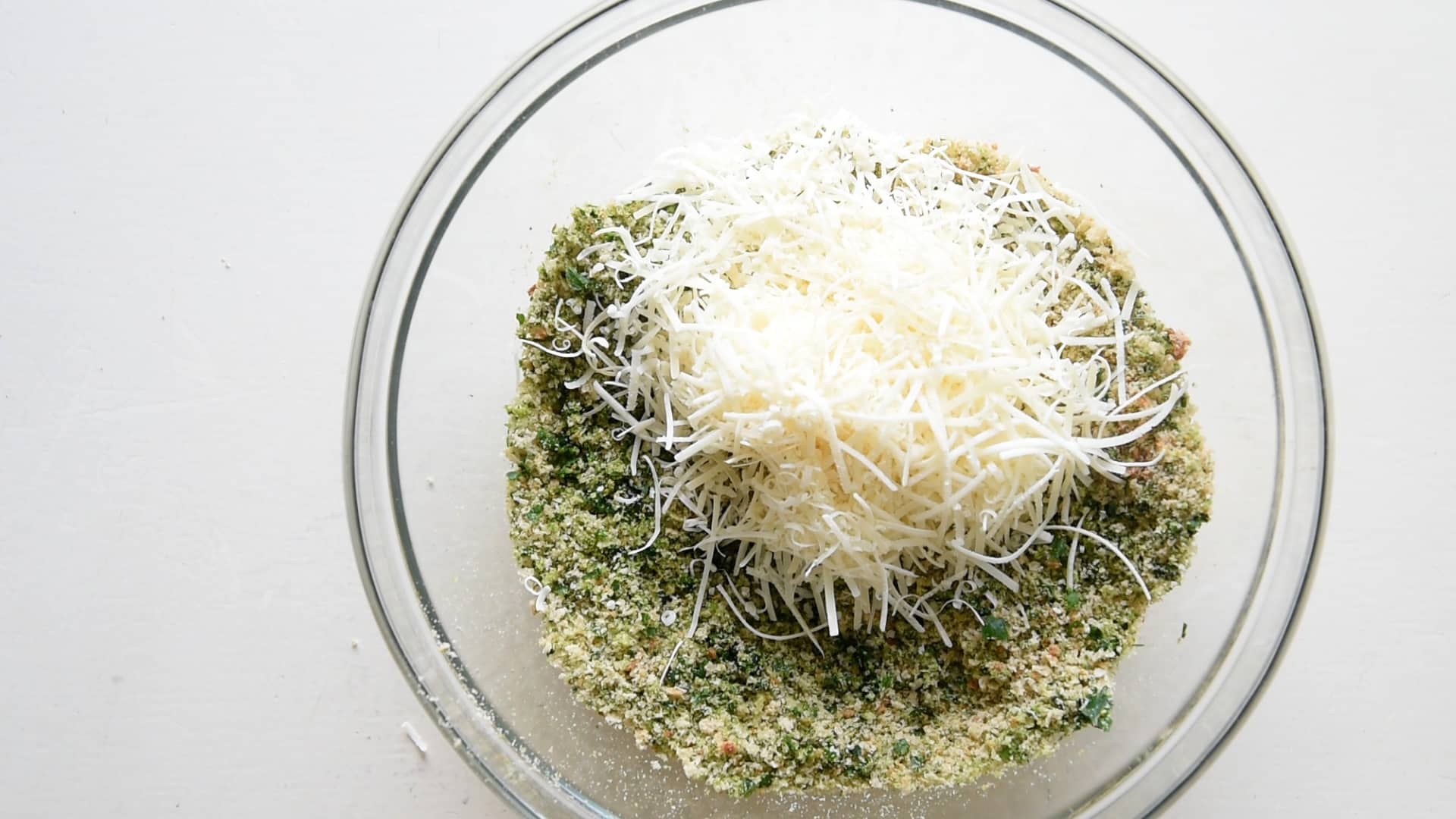 Once all the bread is grated, add the Parmesan cheese