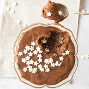 2 ingredients chocolate mousse decorated with sugar stars and a spoon