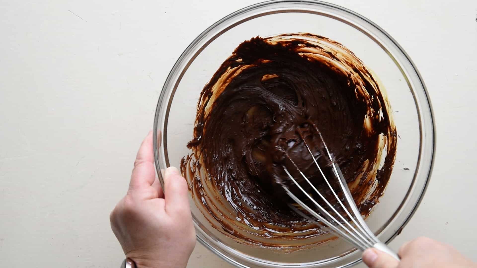 mixing melted chocolate and the egg yolks