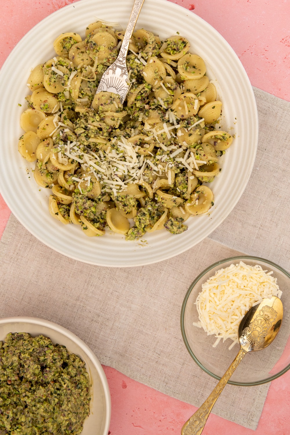 Pistachio pasta served with parmesan cheese and pistachio pesto on a side to be added